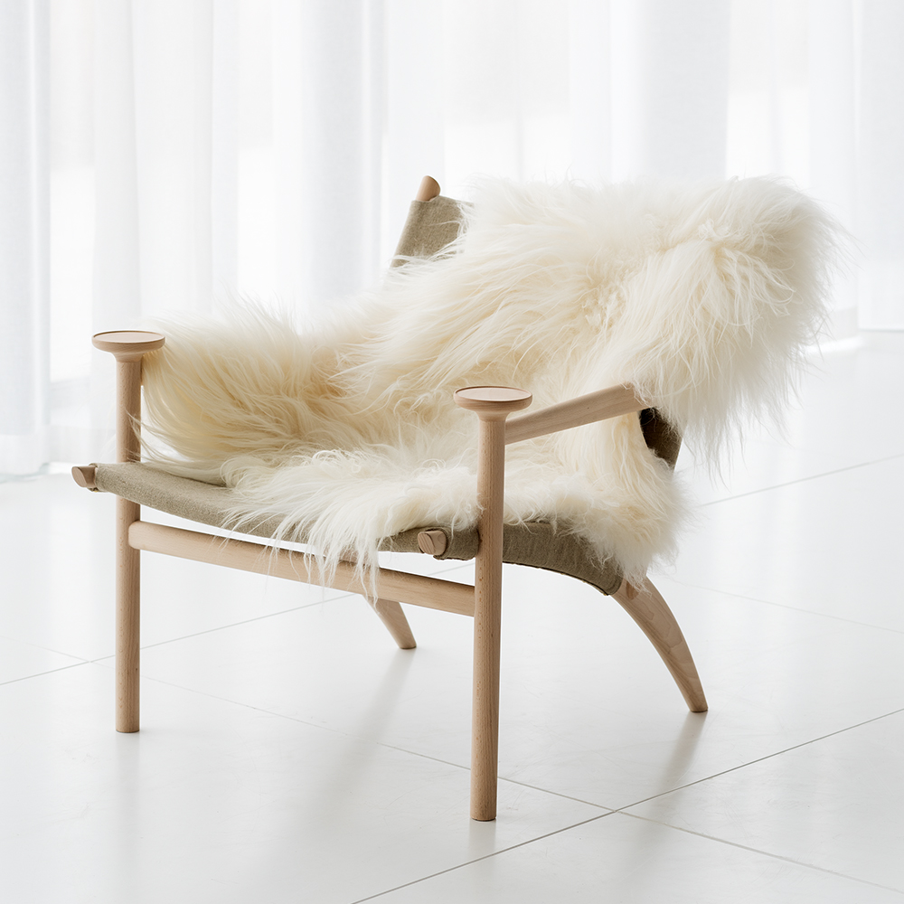 Hedwig David Ericsson Garsnas modern wood leather armchair swedish designer fur throw